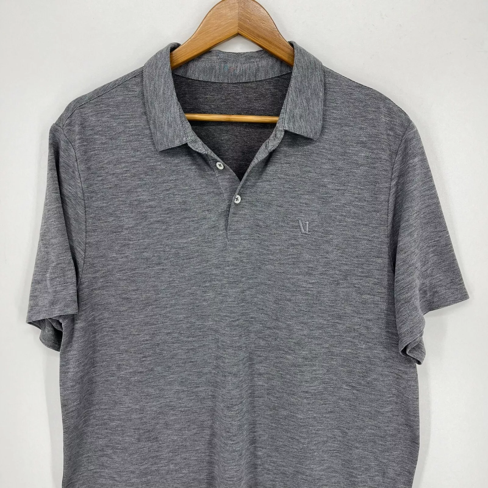 vuori polo short sleeve collared moisture wicking v logo shirt