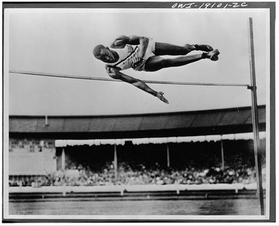 Photo:1940s High Jumper Clearing Bar Track and Field Stadium