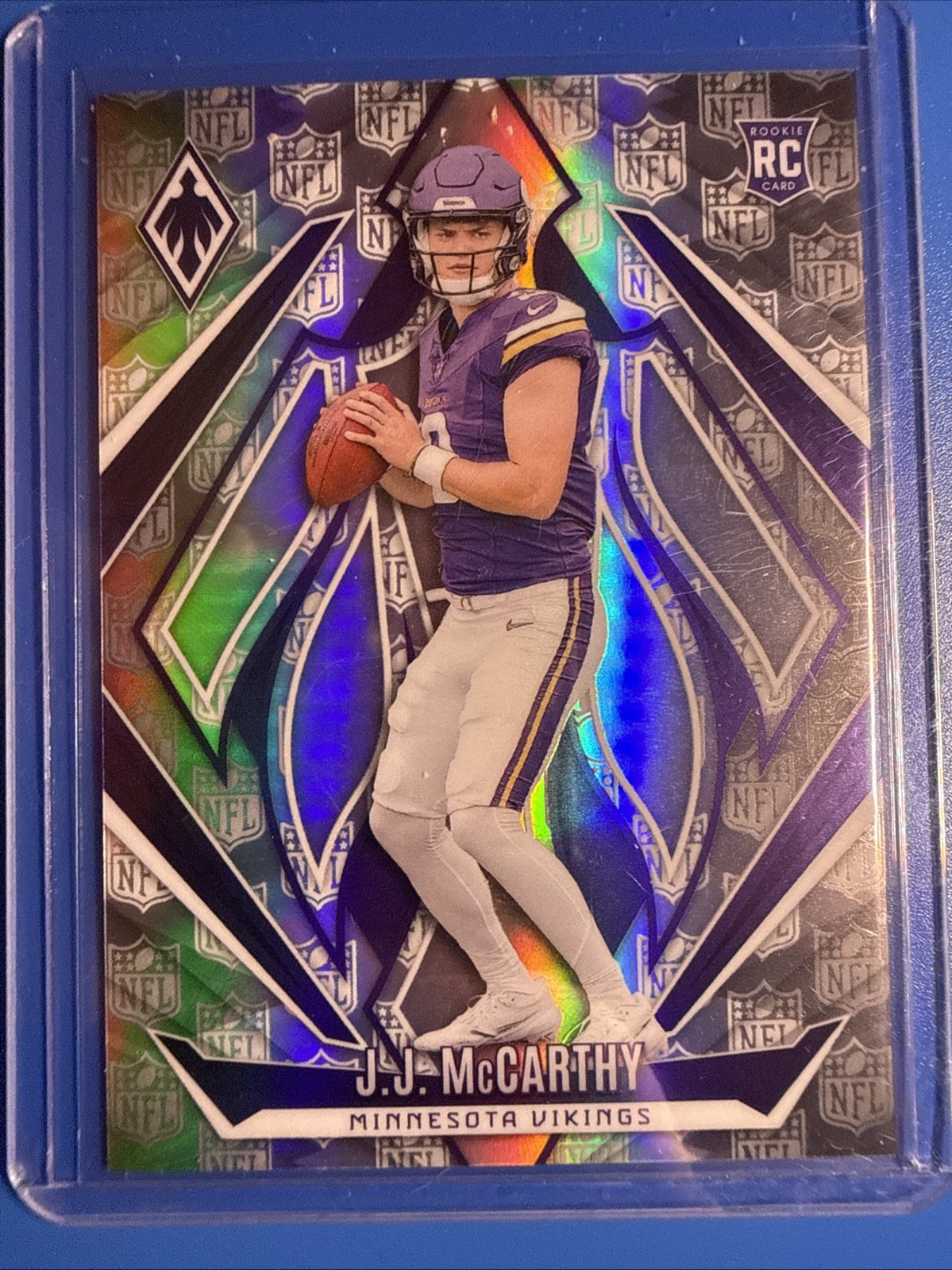 2024 Panini Phoenix - Rookies J.J. McCarthy #185 NFL Shield /150 (RC)