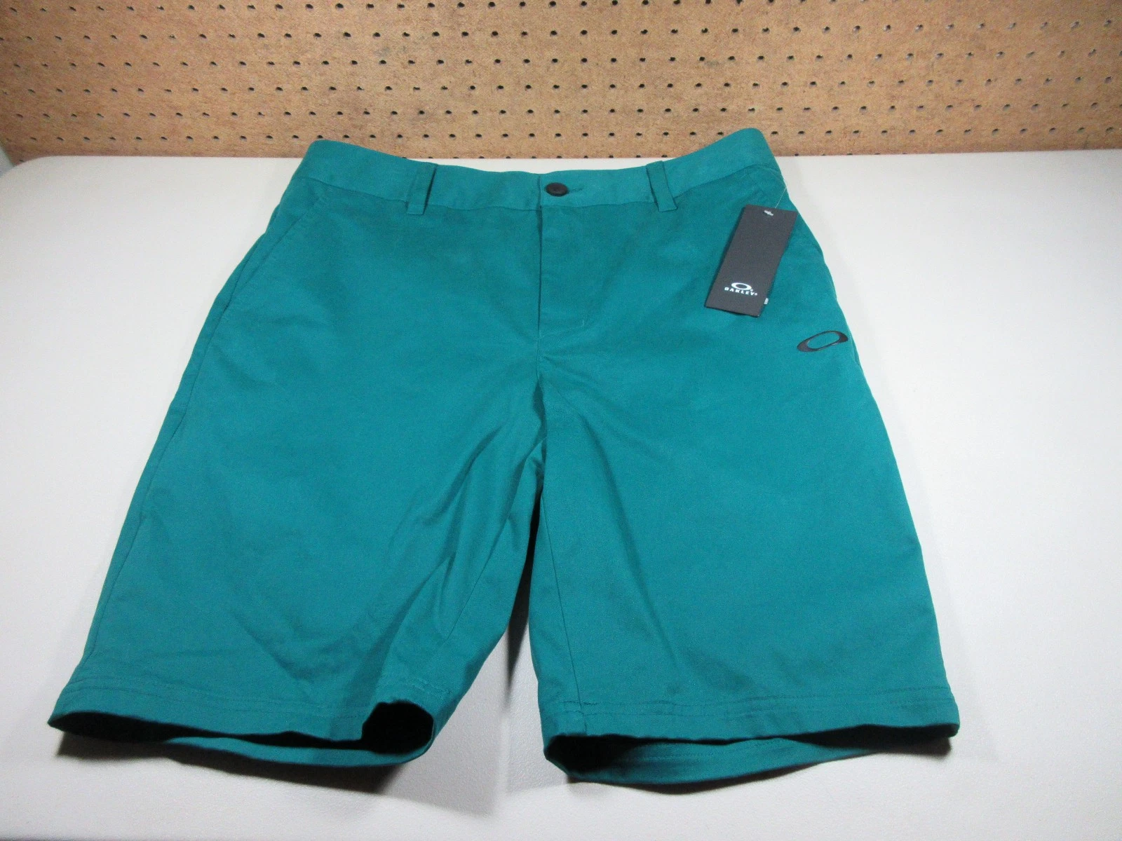 Oakley mens solid petrol ocean Icon chino golf shorts 34 NWT