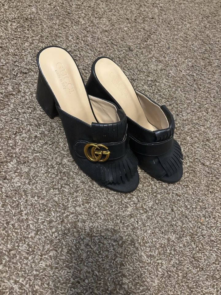 Gucci GG Marmot Kiltie Heel Mules in sleek black Marmot iconic gold logo accent. - Image 3 of 4