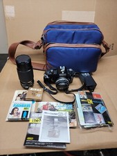 Nikon EM 35mm SLR Camera With Stock 50mm f/1.8 Series E  1 Telephoto Lens Flash