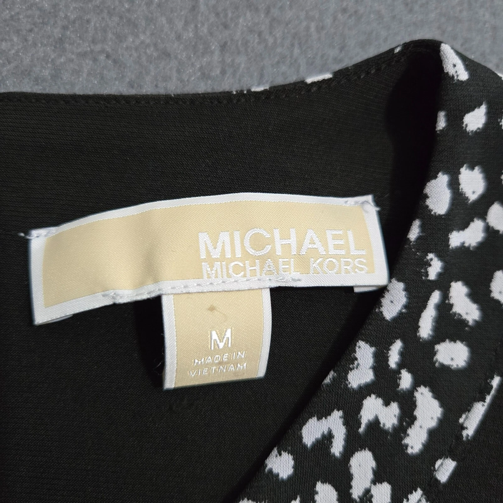 Abito Michael Kors donna M nero manica lunga con orlo stampa animalier bianco e nero