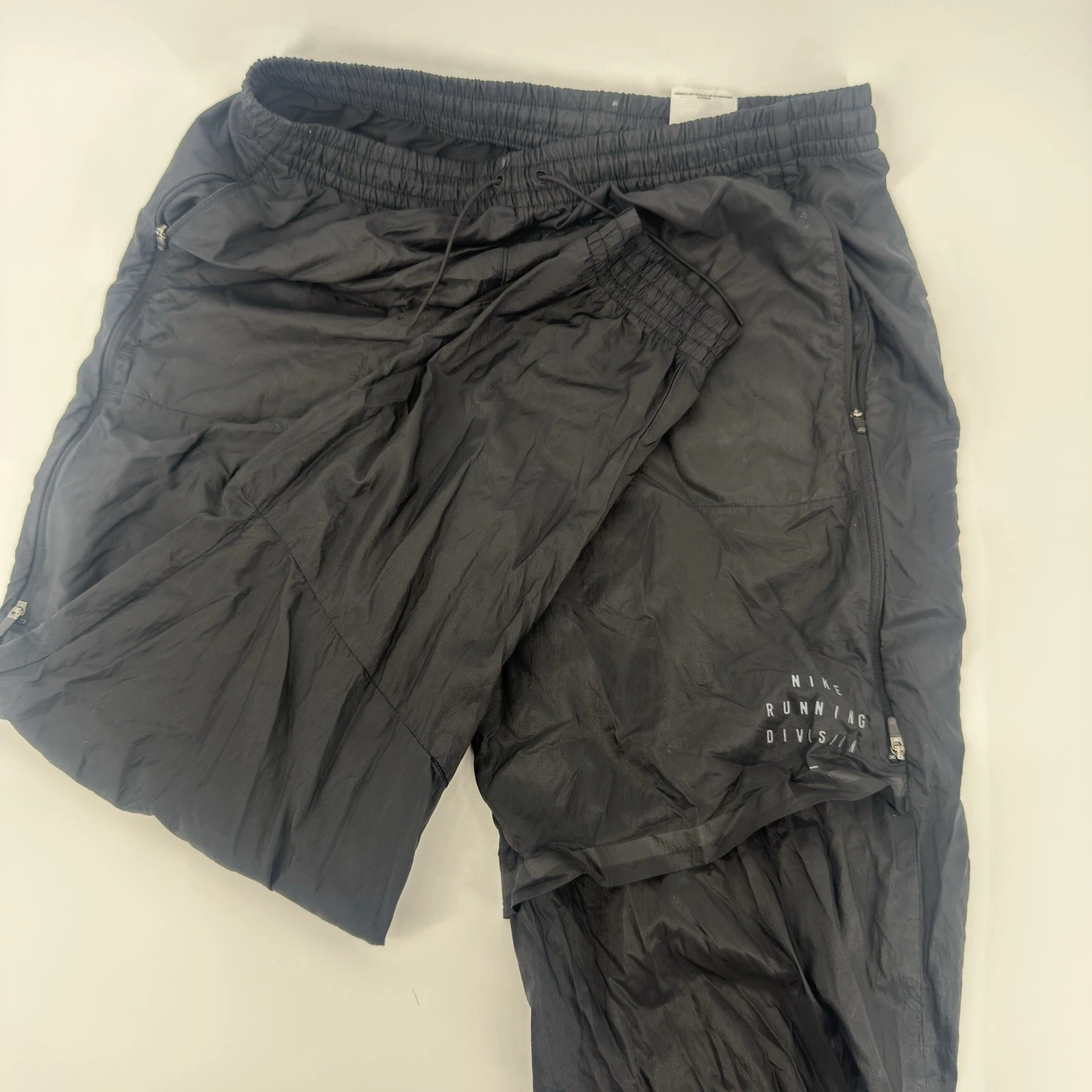 Nike Running Division Pants Mens Medium Black Packable Rain Zip Pocket
Opens in a new window or tab
