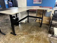 60"x80" electric height adj. L shape desk by Steelcase w/ Beige Laminate Top