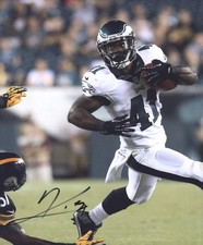 Kenjon Barner signed NFL football 8x10 photo W/Cert Autographed (A0560
