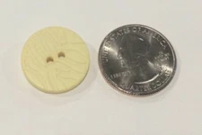 DILL BUTTONS #284502 PALE YELLOW TEXTURED ROUND- 2 HOLE-- 10 BUTTONS IN A SET