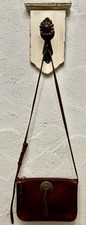 Genuine new leather crossbody bag adjustable strap divided inside.