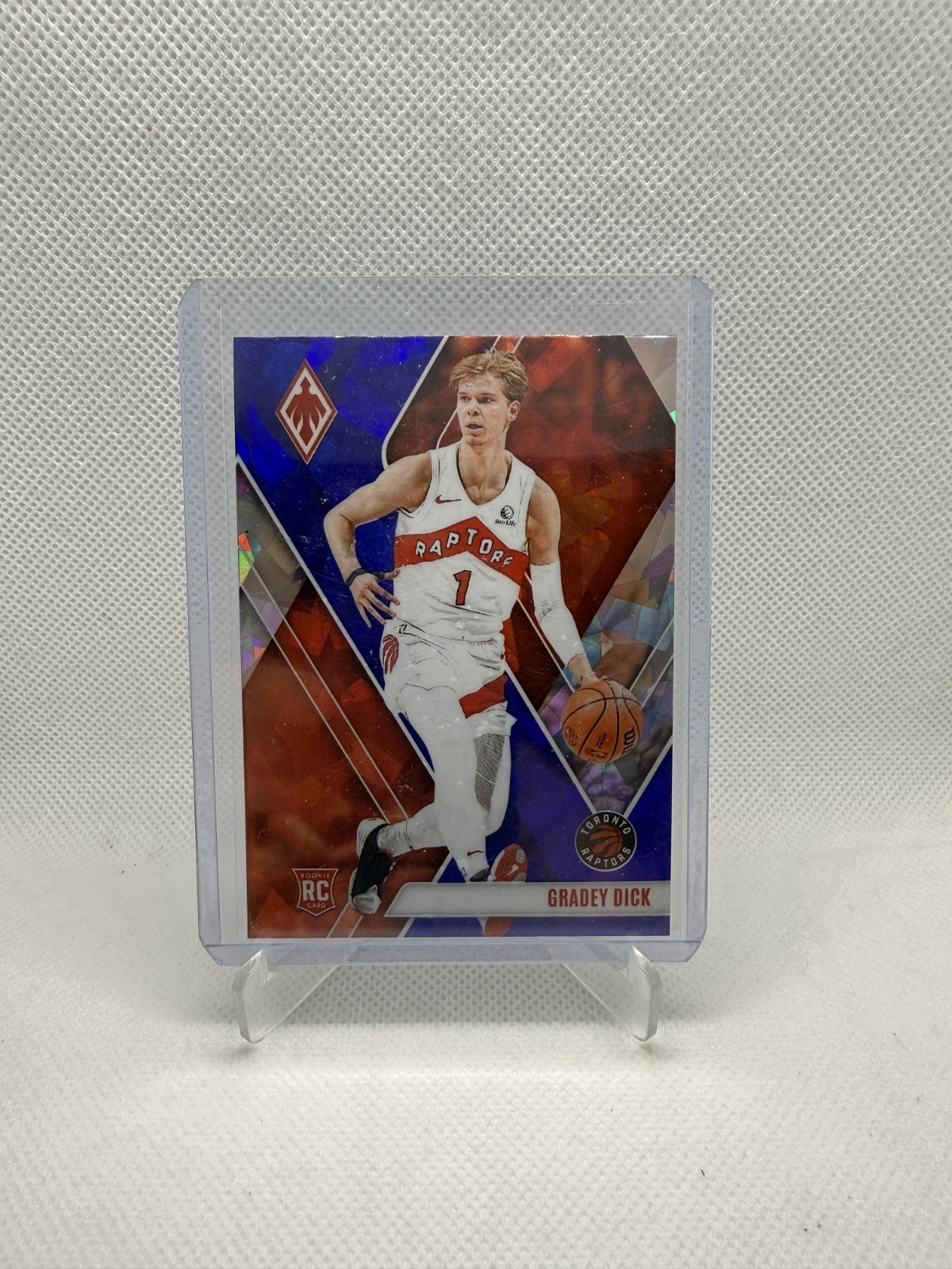 GRADEY DICK - 2023-24 Panini Phoenix #282 - ROOKIE Blue Ice - Toronto Raptors