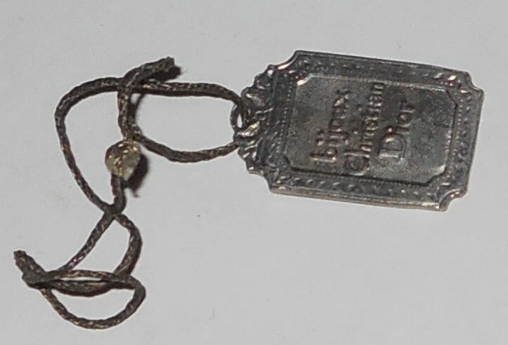 Bijoux Christian Dior argent vintage étiquette estampillée bibelot charme Allemagne original 
