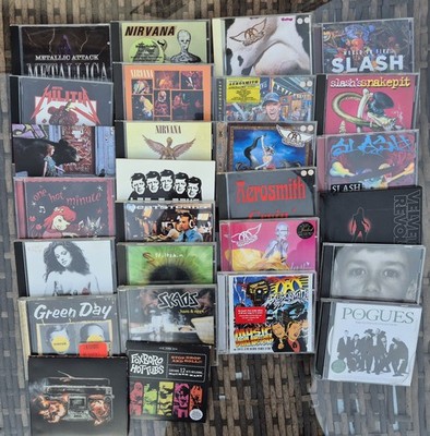 27 CDs 3 Nirvana 4 Slash 6 Aerosmith Green Day 3 Red Hot Chilli  Pogues Velvet .