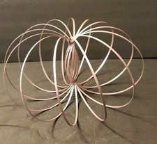 Toro Flux Metal Flow Ring Kinetic Spring Toy Slinky Light Pink