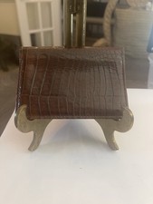 Tumi embossed leather Gusseted cardholder with a clear window