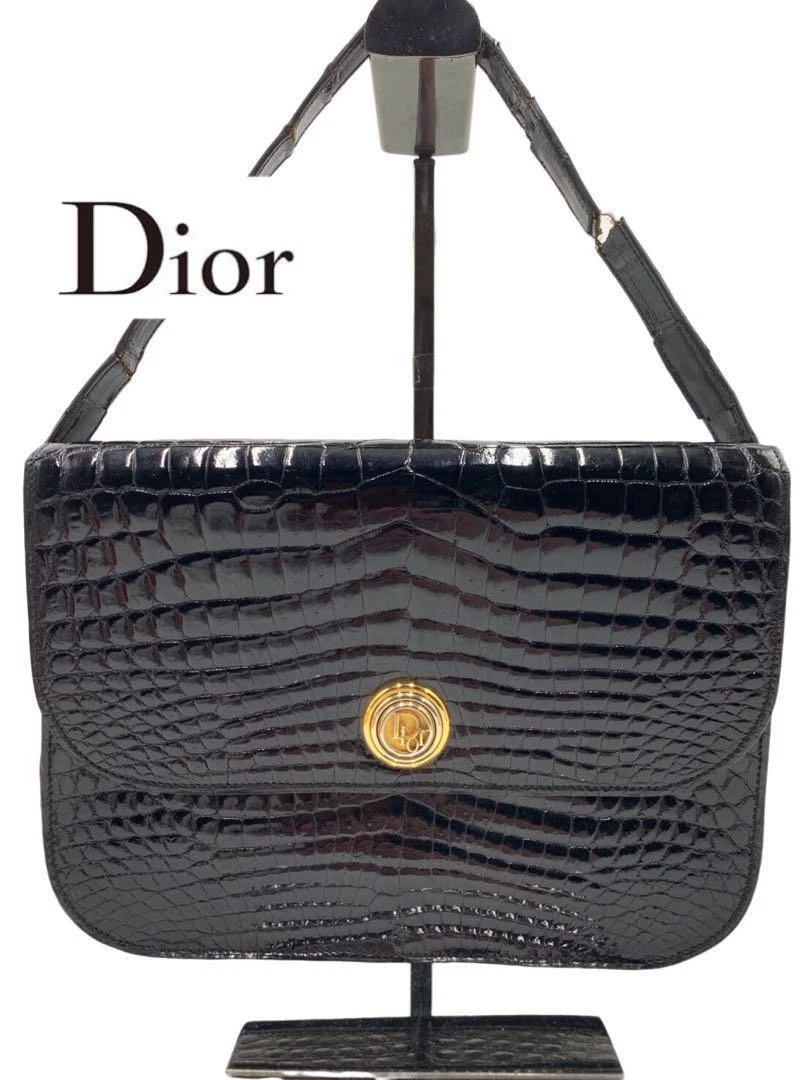 Sac bandoulière noir brillant marque Christian Dior en cuir véritable