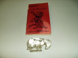 Glass goat from 1941 and notebook 