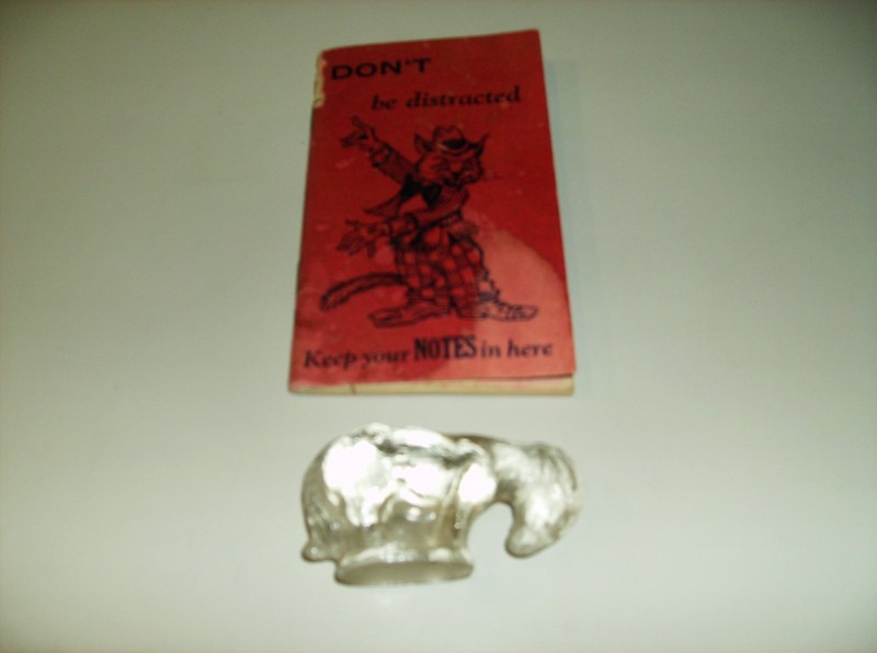Glass goat from 1941 and notebook 