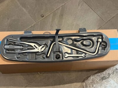 BMW Trunk Tool kit- comes with pliers, screw driver, lug wrench, and double side