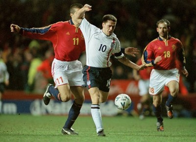 Michael Owen of England goes past Markel Bergara of Spain at an In- Old Photo