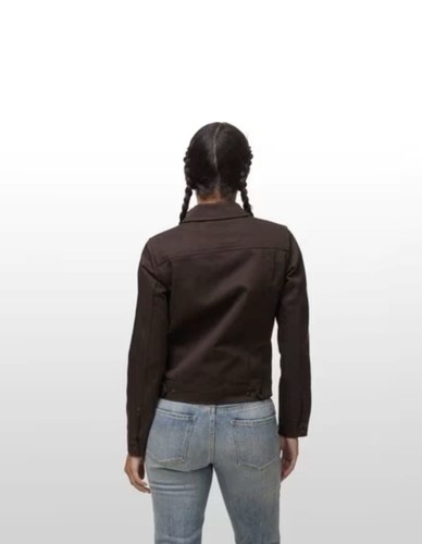 Brown canvas FILSON women’s jacket with long sleeves, button front, and two front flap chest pockets.