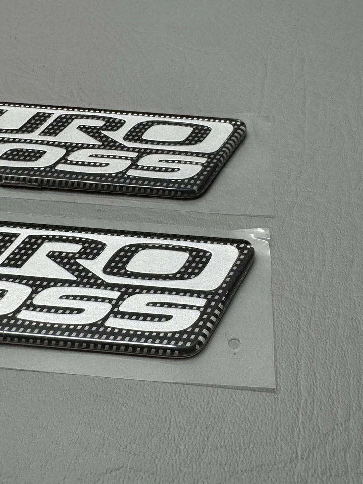 Mitsubishi Raider Duro 2006-2009 emblema de puerta lateral cruzada logotipo insignia usado conjunto OEM Foto 4 de 4