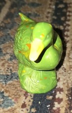 vintage duck figurine, possibly made of celluloid or ceramic, originating...