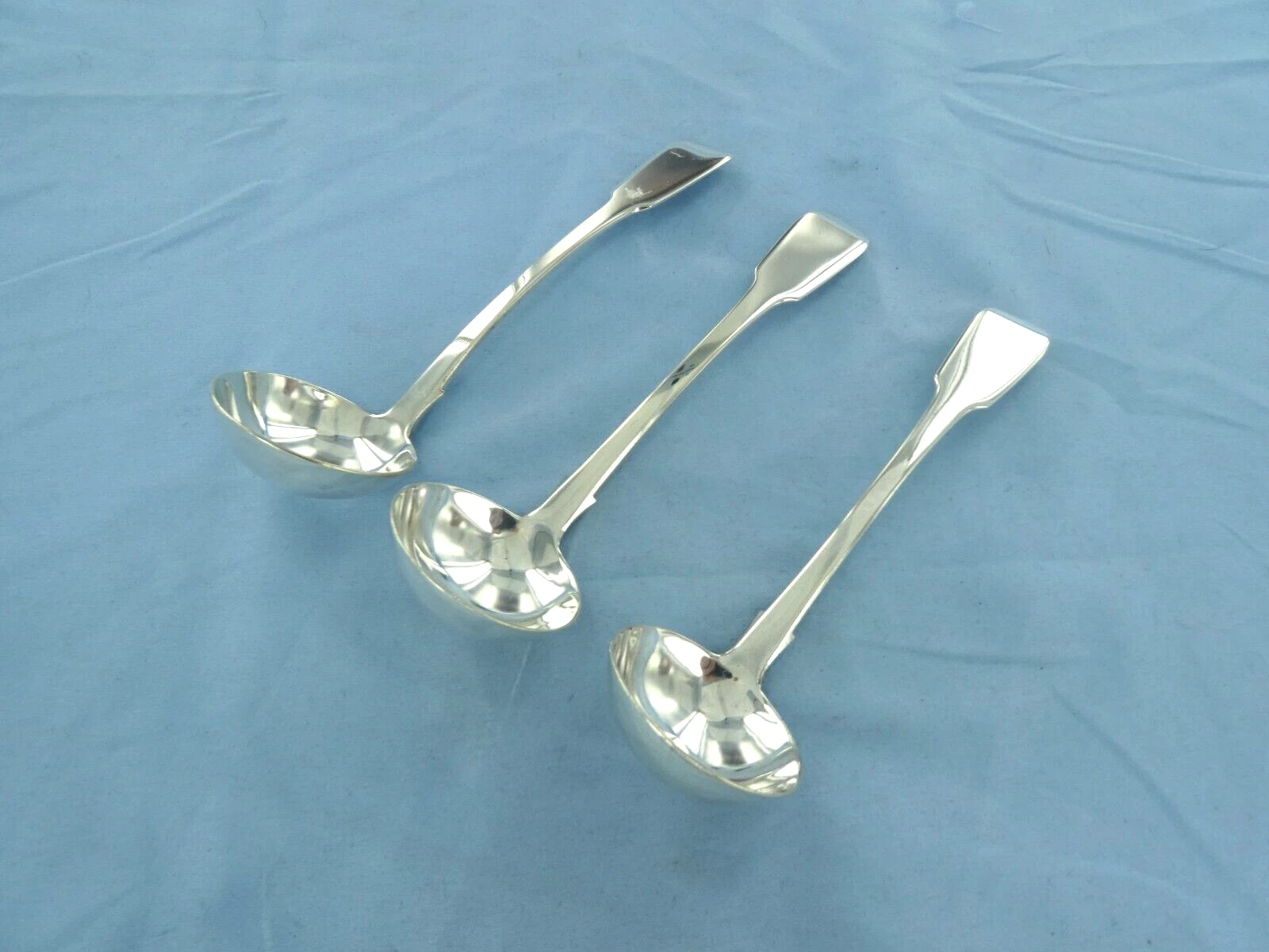 AN ANTIQUE SET OF THREE STERLING SILVER FIDDLE BACK SAUCE LADLES,DUBLIN 1837.
Opens in a new window