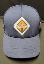 INTERNATIONAL Logo Trucker Hook & Loop Back Hat Blue STX Adjustable Cap