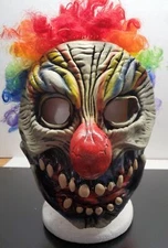 Scary zombie clown with big red nose latex mask and multi-color hair - Halloween