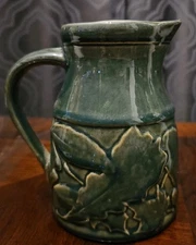 Rowe Pottery Green Pitcher w/Maple Leaves  7"  high