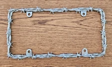 Bell Automotive 22-1-46144-8 Universal Barbed Wire Design License Plate Frame