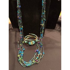 Seed bead necklace bracelet set. Both pieces are multi string in turquoise.