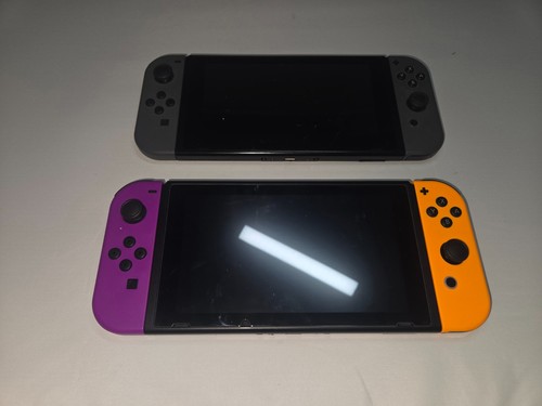 2 Nintendo Switch Handheld Game Console both for parts doesn't turn on or charge