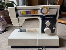 Toyota 2400 Heavy Duty Metal Sewing Machine, manuals, cover and accessories.