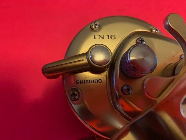 SHIMANO TRINIDAD TN 16 GOLD CONVENTIONAL FISHING REEL + GOLD SHIMANO TRINIDAD TN 16 GOLD CONVENTIONAL FISHING REEL + GOLD