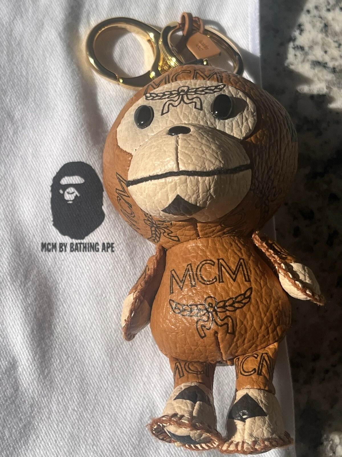 A BATHING APE (BAPE) Charm Milo bambino MCM × BAPE