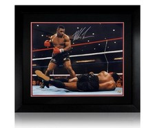 Large framed photo signed by Mike Tyson showing his championship winning victory