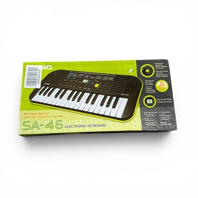 E1 Casio SA-46 Mini Electronic Keyboard 32-Key Green 100 Tones 50 Patterns