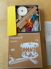 Kraul , Das Karussell Holzbausatz  mit 3 Mitfahrpüppchen