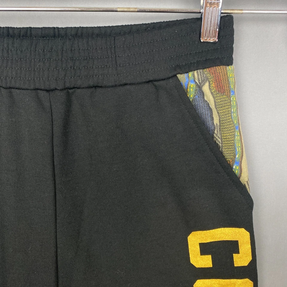 Pantalones deportivos Coogi para niños 18 negros con logotipo multicolor bolsillos elásticos en la cintura ligeros Foto 3 de 4