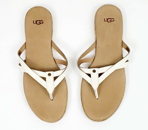white strappy flip flops