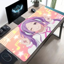 A Large Gaming Mouse Pad Featuring a Purple-Haired Girl with a Musical Note Des