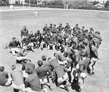 Coach Howard Jones giving pep talk to University of Southern Calif- Old Photo