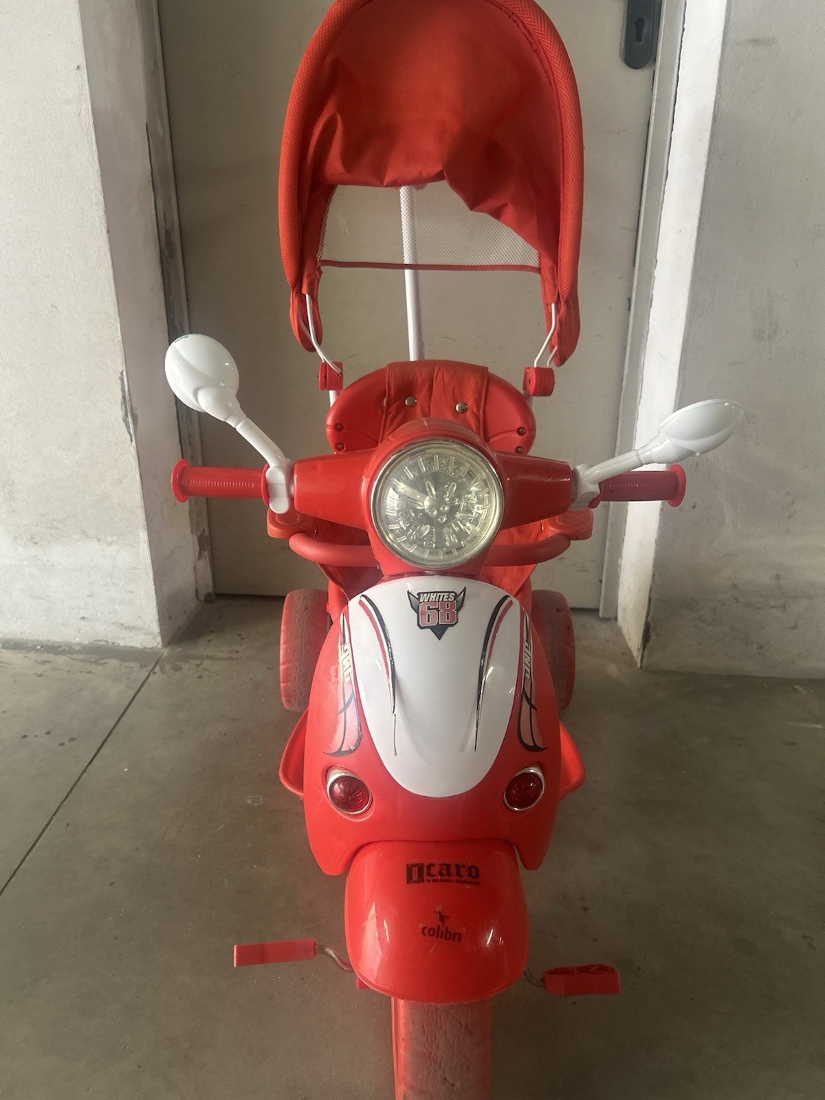 Colibrì triciclo passeggino bimbo rosso con cappuccio e maniglione di spinta