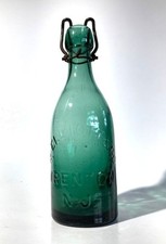 Near Mint Teal Blue Pony Soda or Beer Bottle with Wire ELLIOTT & CO TRENTON N.J.