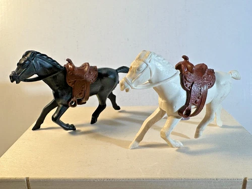 Vintage soft Plastic REL 60mm horses with Marx original brown vinyl saddles.