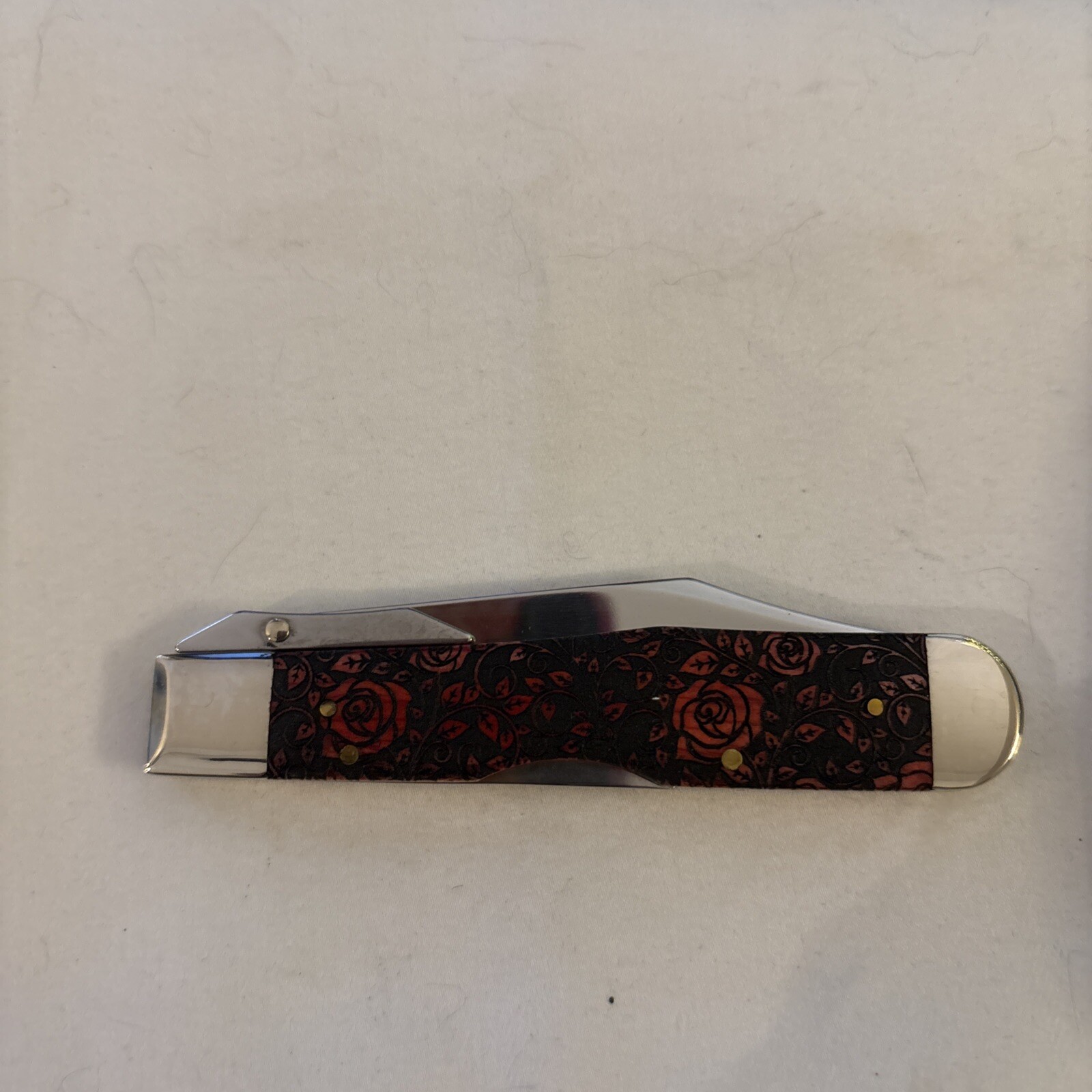 DISC. CASE XX 6111-1/2 SS CHEETAH RED ROSES SFO 1/500 ITEM # CA23119  R