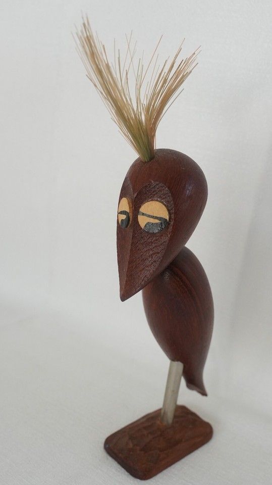 A teak bird-shaped bottle opener/corkscrew is exactly the kind of tiny sculptural MCM object that stops guests dead in their tracks.