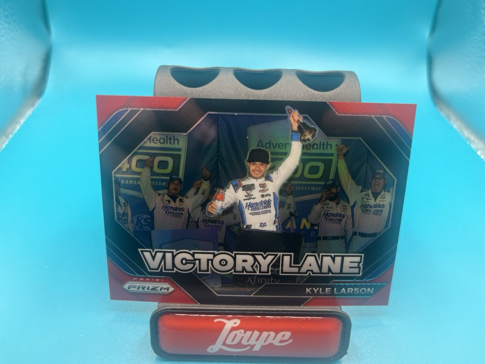 Kyle Larson 2024 Panini Prizm Victory Lane Red Prizm 30/99 #23 HendrickCars.com