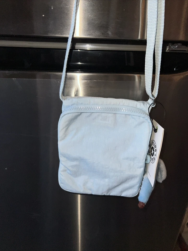 Kipling Nuevo Bolso Bandolera Eldorado Pequeño Plateado Liso Azul Desmayado Nuevo Con Etiquetas Foto 2 de 4