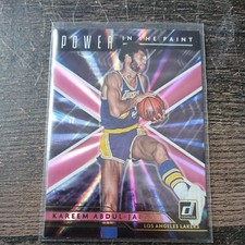 2021-2022 Donruss Kareem Abdul-Jabbar Power In the Paint Holo Pink Laser Card. 